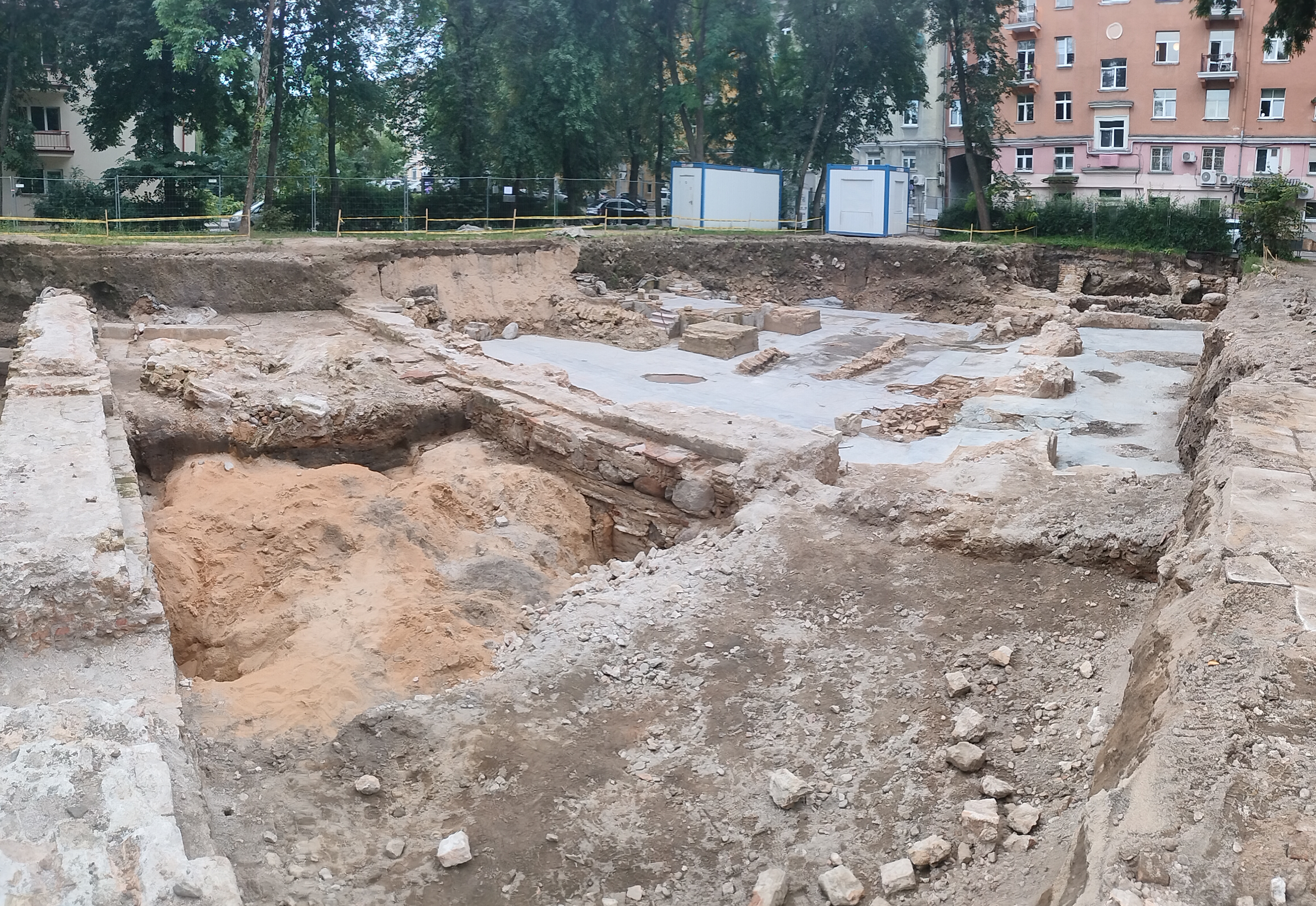 Excavation workers at trench edge